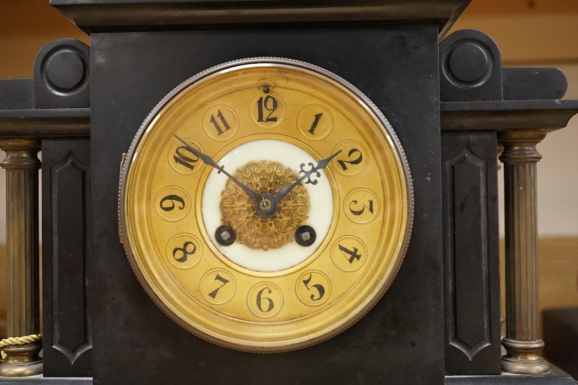 A black slate and gilt metal mounted mantel clock, 36cm high.